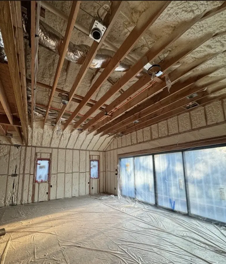 Interior walls and ceiling insulated with spray foam during new construction in Sugar Hill